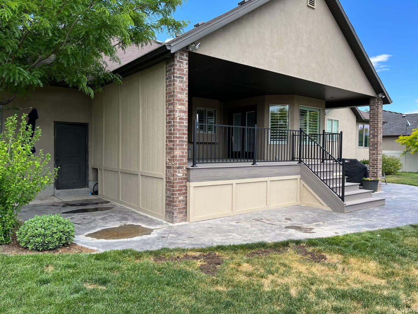 Covered patio cover integrated with composite deck — Utah County exterior project